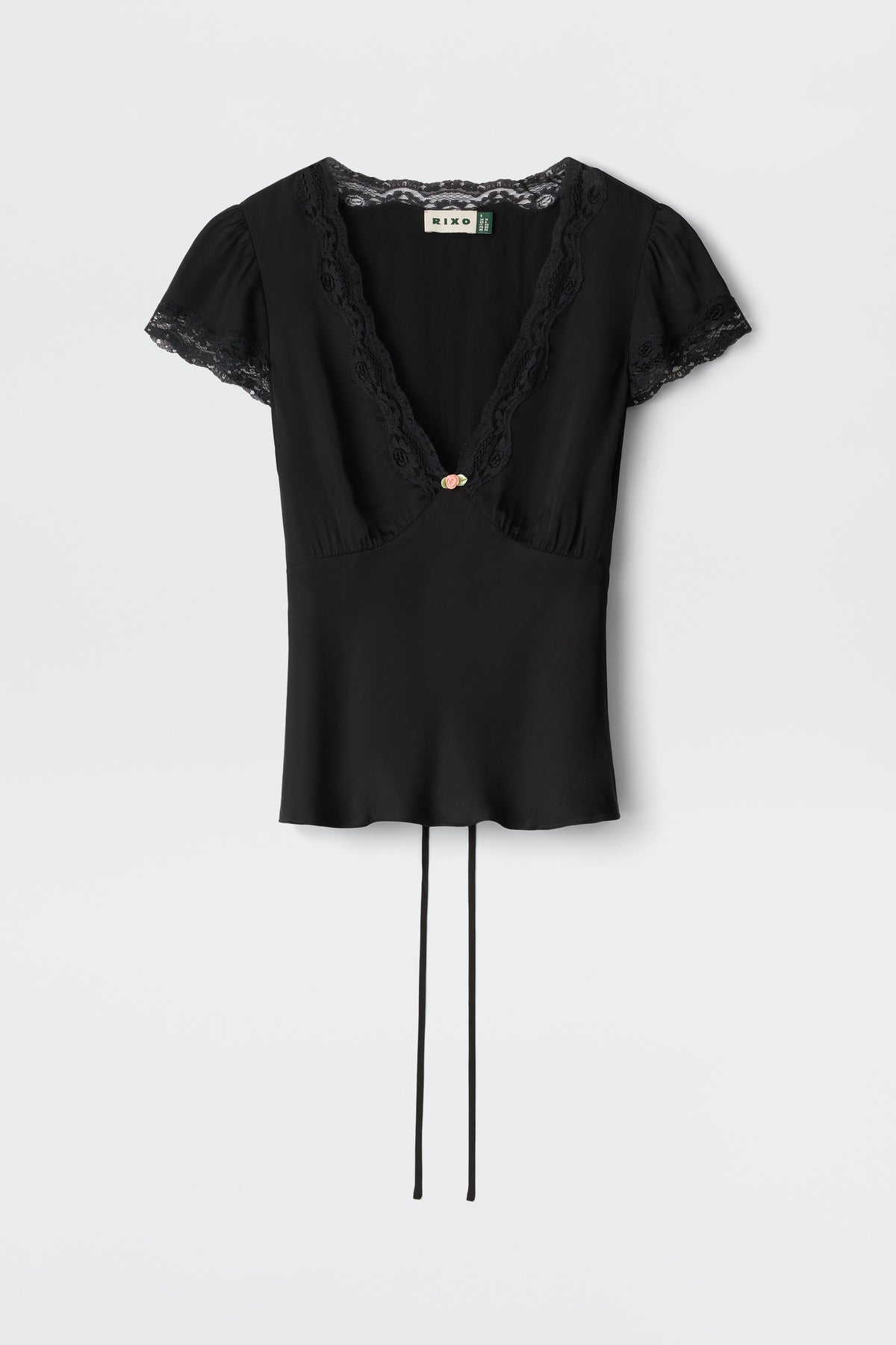 The Karia - Black blouse features short sleeves, lace trim on the V-neck and sleeves, a central decorative button, and two long waist ties.