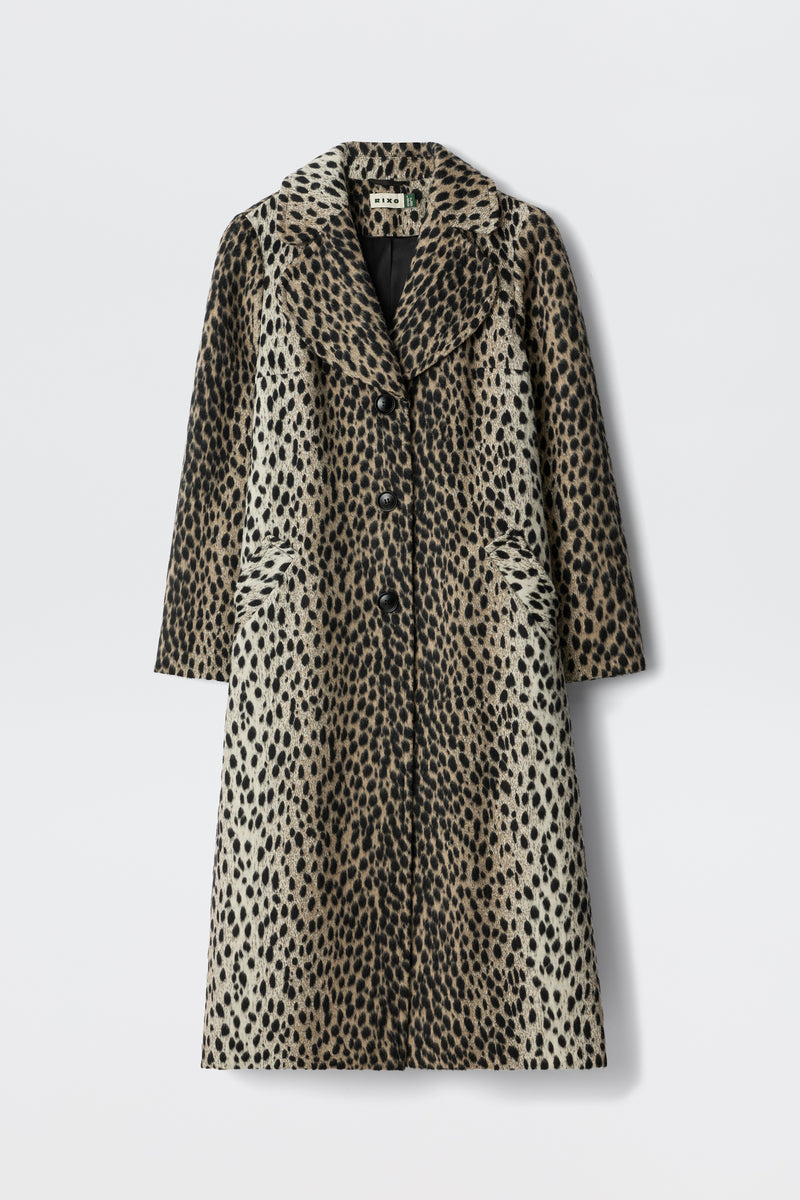 The Rosemary - Antelope Spot Jacquard Black is a long, knee-length coat with a spotted pattern, curved lapels, and three front buttons, shown against a plain white background.