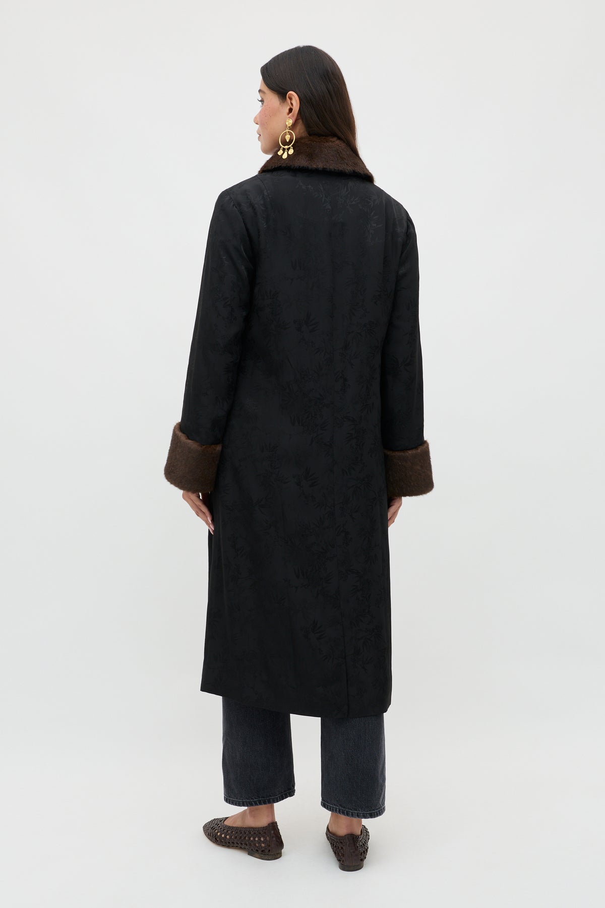 A woman wearing the Jonah - Black coat.