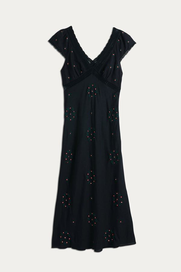 The Iggy - Rose Trail Embroidery Black dress features a black short-sleeve V-neck design with cotton lace trim and colorful beaded embroidery. Its fitted waist and gently flared skirt make it a versatile choice for any occasion.