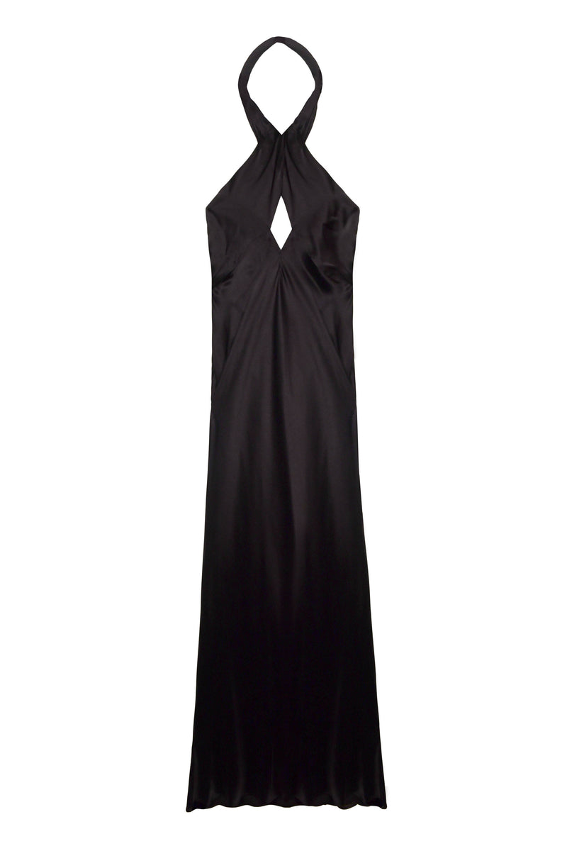 The Dune - Black is a sleeveless, floor-length silk-satin gown with a halter neckline that crosses at the neck and a diamond-shaped chest cutout, making it an elegant choice for black tie events.