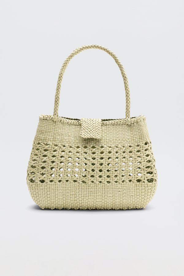 Niamh - Butter is a beige woven handbag inspired by vintage styles, featuring a braided top handle and a textured pattern, displayed against a plain light background.