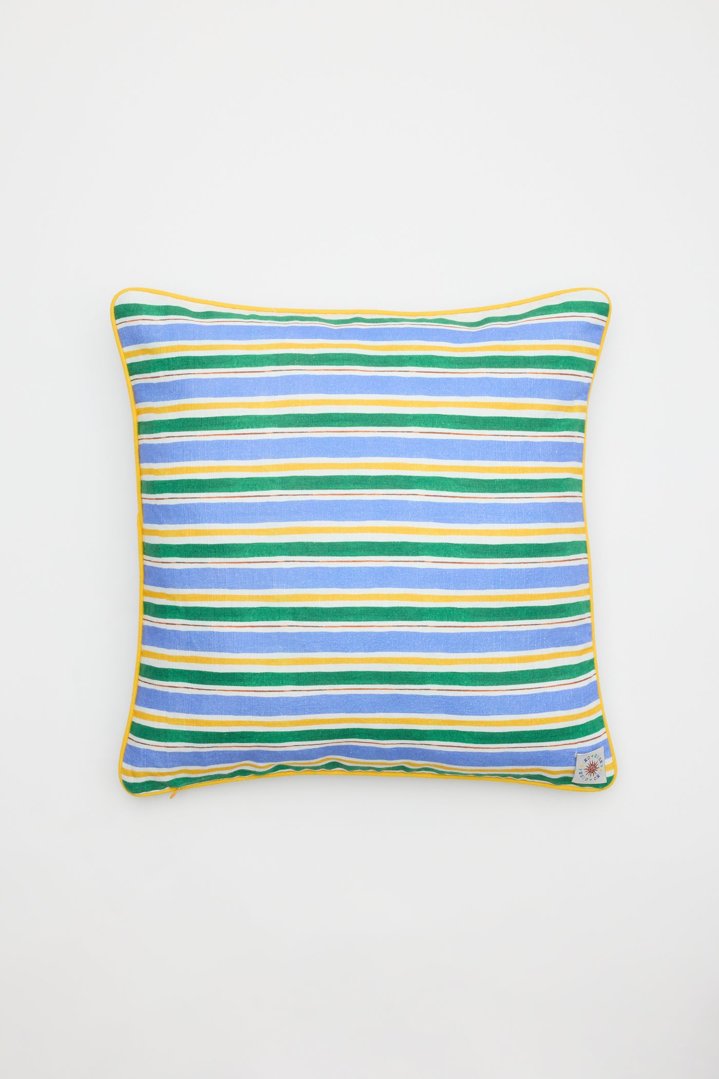 The Romilly - Cover Mythos Mix Ivory is a square pillow with blue, green, yellow, and white horizontal stripes and yellow piping along the edges, shown on a plain white background.