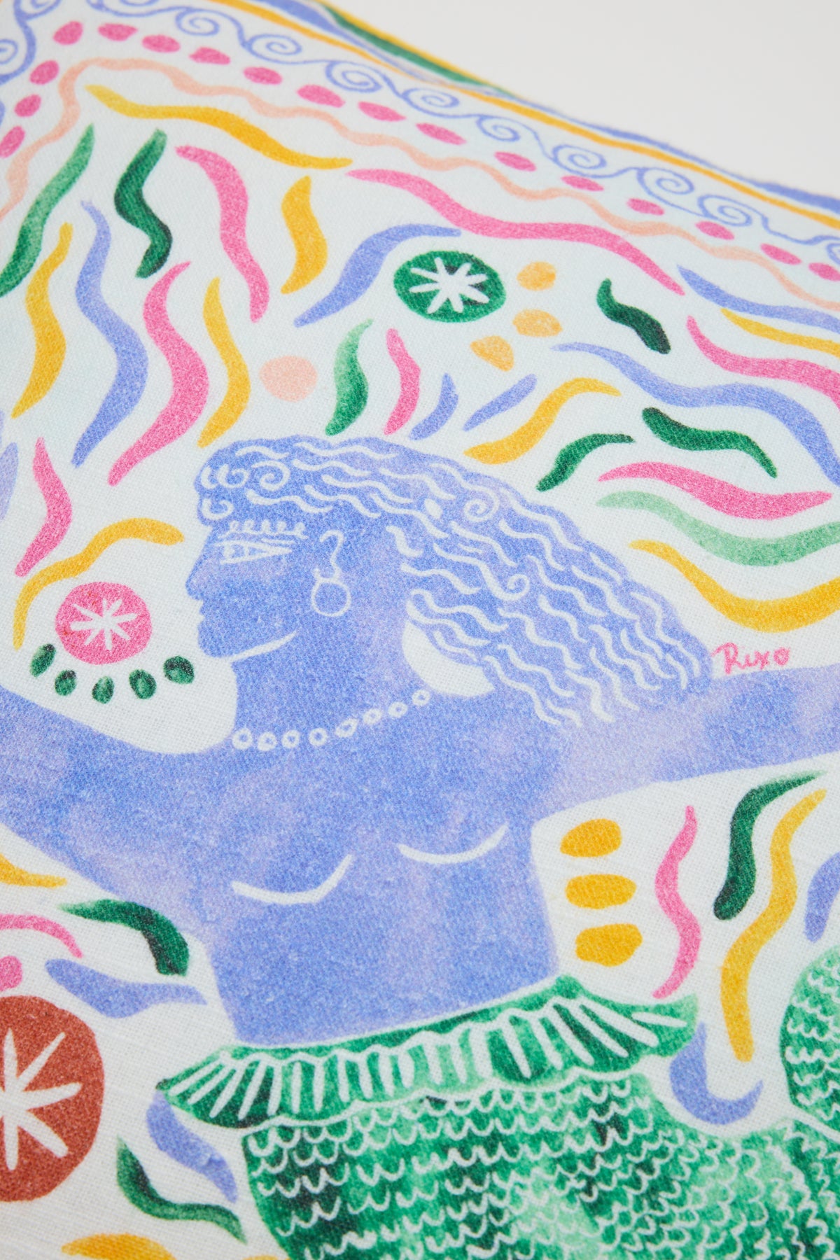 Colorful illustration for "Romilly - Cover Mythos Mix Ivory": a mermaid with wavy purple hair, pearl jewelry, and a green-scaled tail surrounded by vibrant abstract swirls and star-like shapes on a white background.