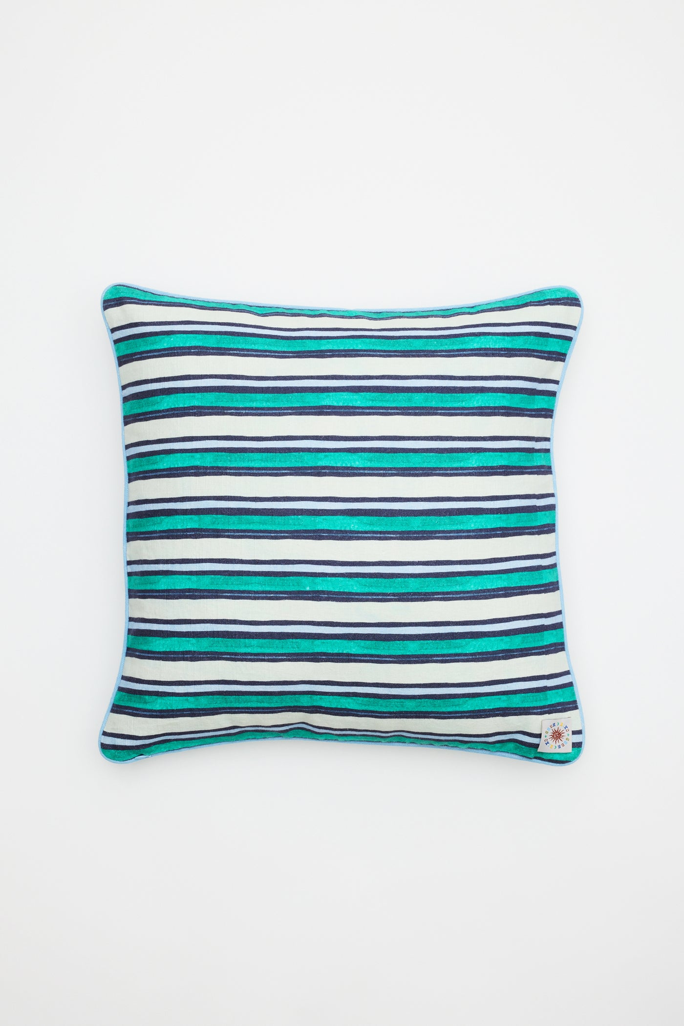 The Romilly - Cover Mythos Mix Navy is a rectangular pillow cover featuring horizontal stripes in blue, teal, and white on a plain white background, finished with a small corner tag.